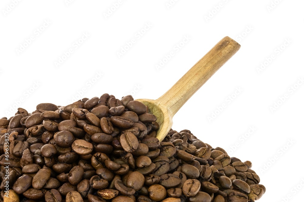Fototapeta premium Close up photo of coffee beans with a wooden spoon