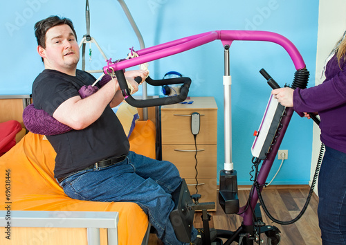 Young man with infantile cerebral palsy. photo