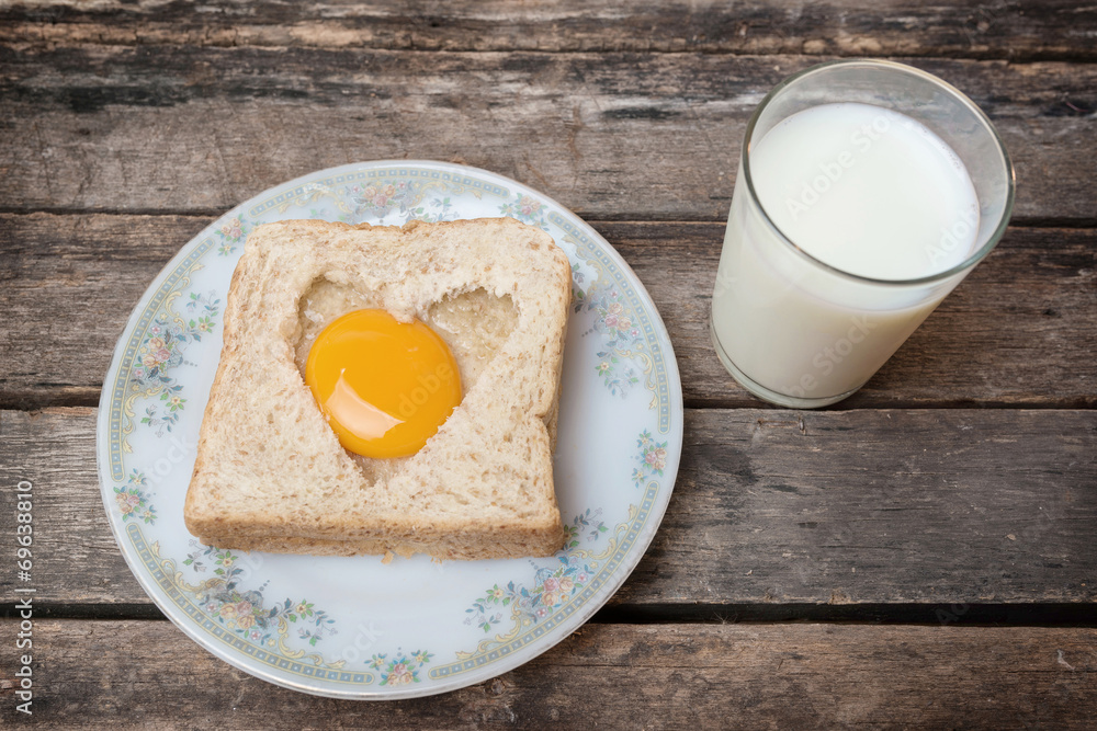 Egg with whole grain bread wooden background Egg with whole grain bread wooden background