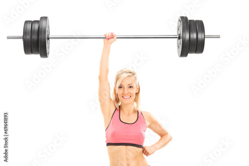 Strong woman lifting a weight with one hand