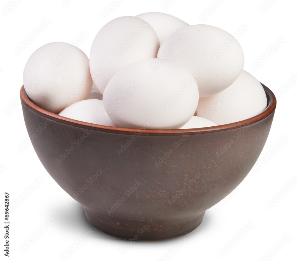 White Eggs Into Ceramic Bowl White Eggs Into Ceramic Bowl