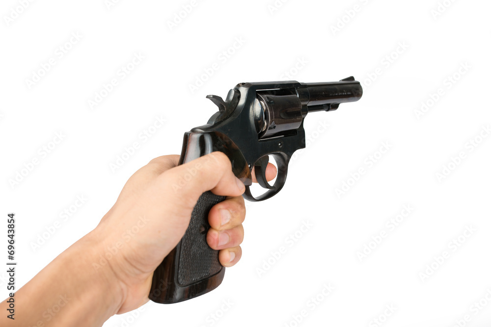 Men's hand with a Black revolver gun isolated