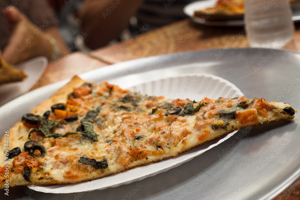 Slice of traditional New York Style pizza Slice of traditional New York Style pizza
