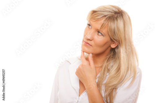 Thinking mature woman looking up isolated