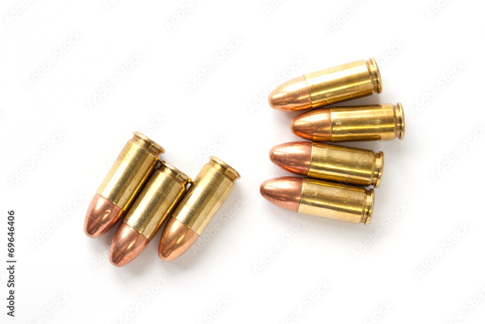 9mm bullet for a gun isolated on white background. 9mm bullet for a gun isolated on white background.