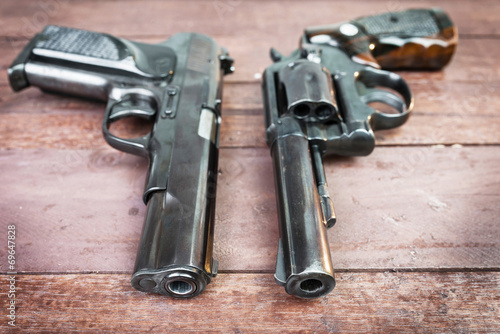 Black revolver gun and Semi-automatic 9mm gun