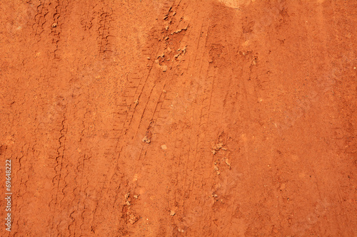 Wheel tracks on red soil rural road