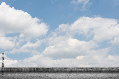 concrete ground with cloudy sky