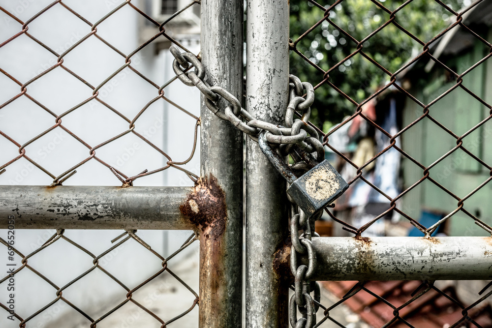Lock on a chain link security fence Lock on a chain link security fence