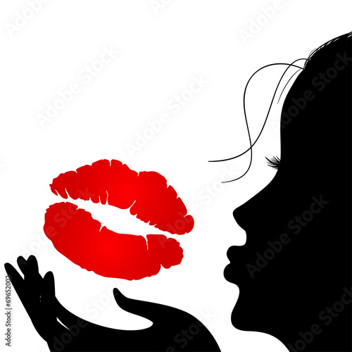 Silhouette of a girl who sends an air kiss