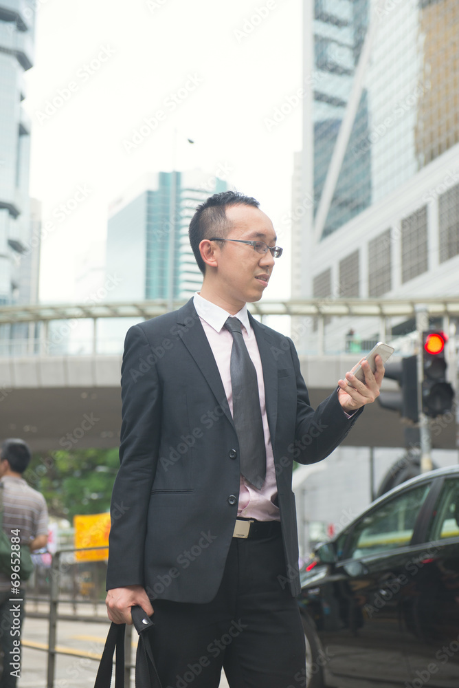 hong kong businessman in busy central district, light vintage bl hong kong businessman in busy central district, light vintage bl
