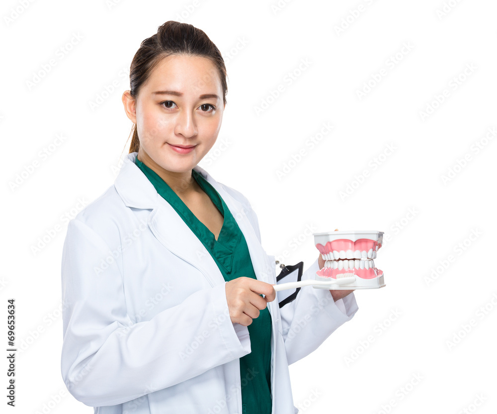 Indonesian dentist present the dental care concept Indonesian dentist present the dental care concept