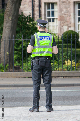 EDINBURGH, SCOTLAND - JULY 21: Police officer on guard duty near