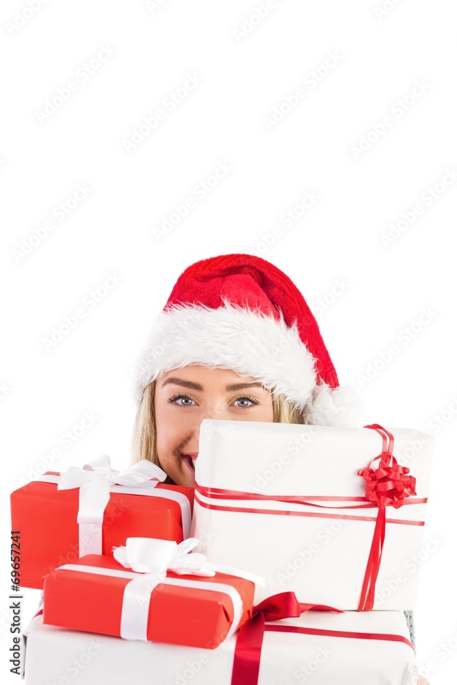 Festive blonde holding pile of gifts Festive blonde holding pile of gifts