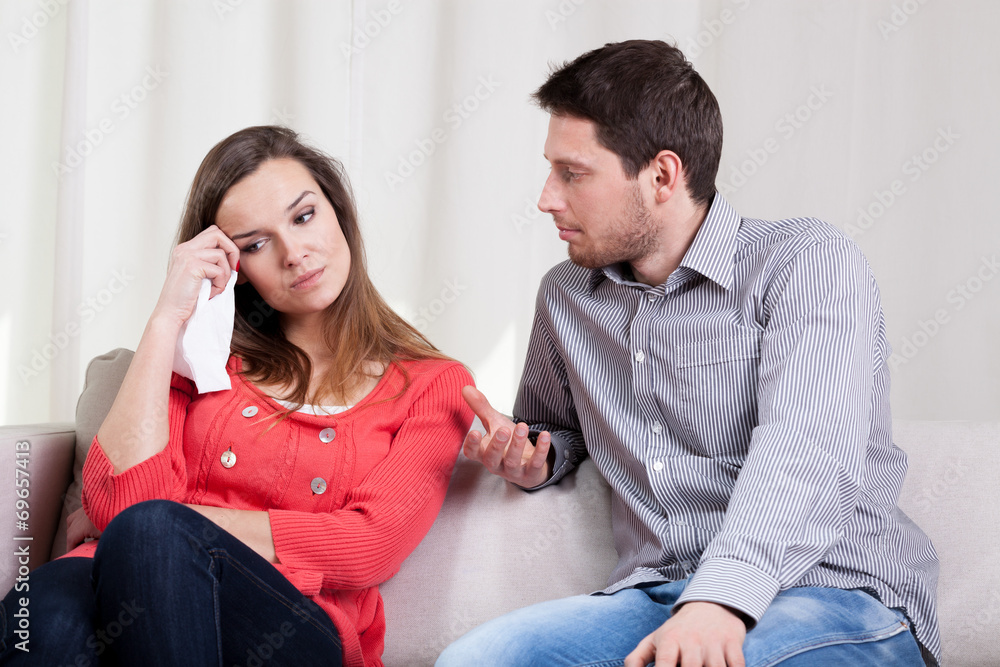 Wife crying by her husband Wife crying by her husband