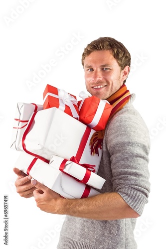 Man holding some large presents © WavebreakmediaMicro