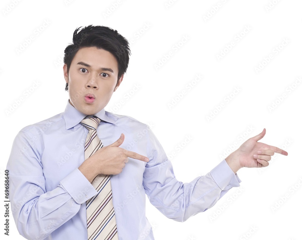 young business man in a suit pointing with his fingers