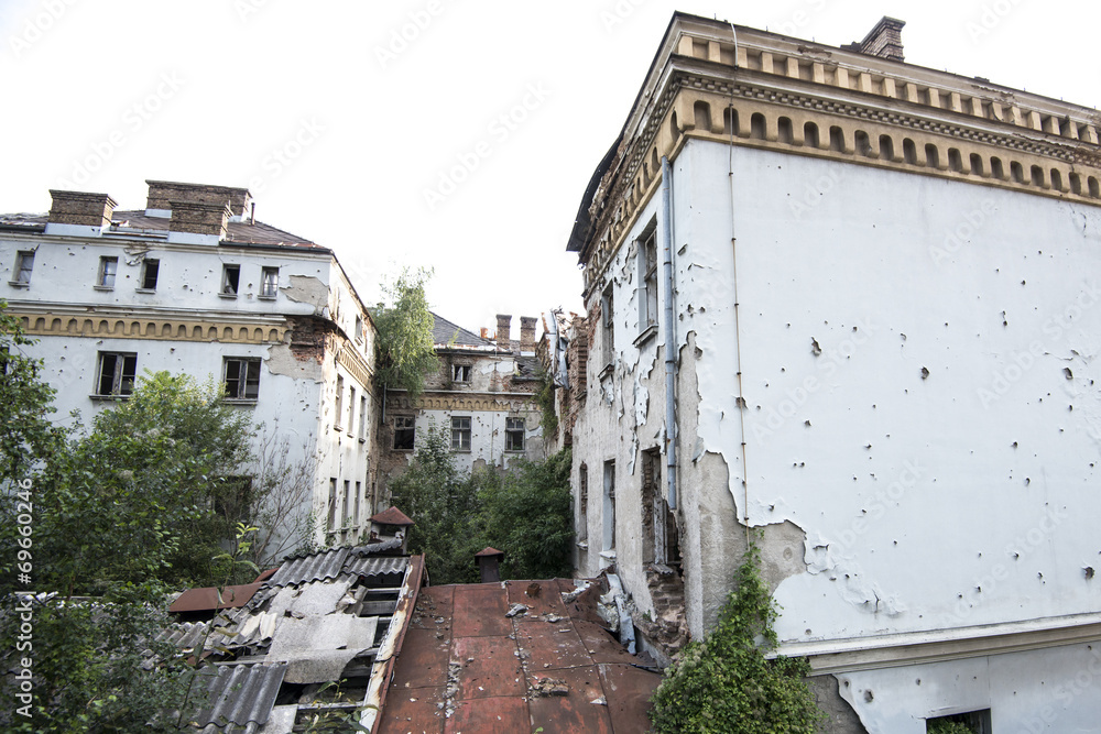 Bullet-riddled rooms building exterior in Sarajevo