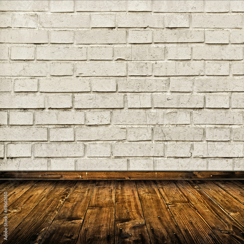 Room interior with white brick wall and wooden floor