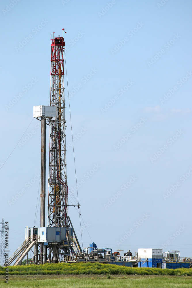 oil drilling rig with equipment on field