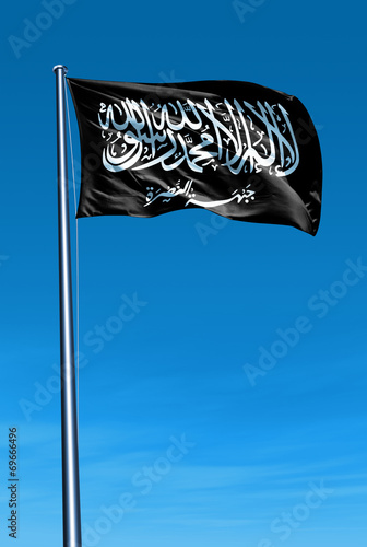 Al Nusra Front flag waving against blue sky