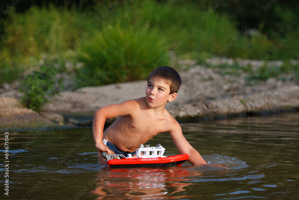 Fototapeta premium Boy playing in the river