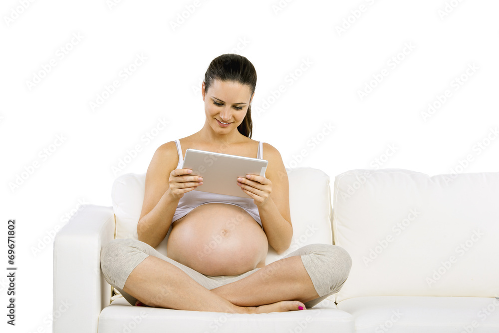 Pregnant woman with digital tablet Pregnant woman with digital tablet