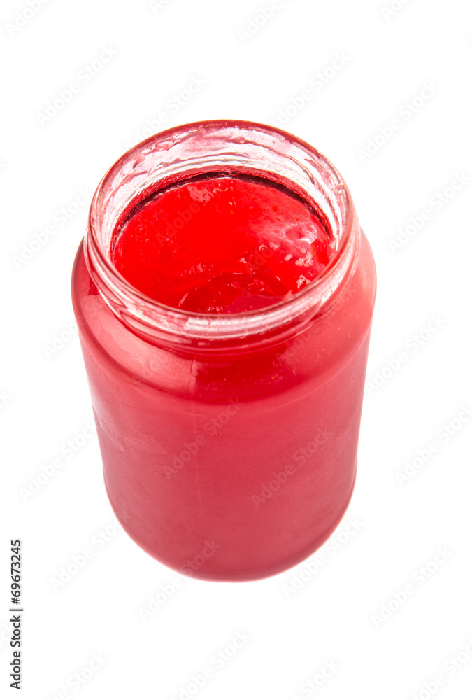 A bottle of strawberry jam over white background A bottle of strawberry jam over white background