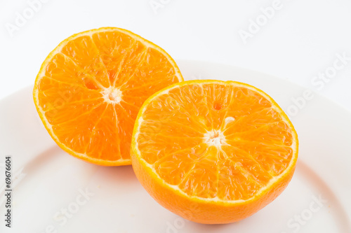 Half orange fruit on white background  fresh and juicy