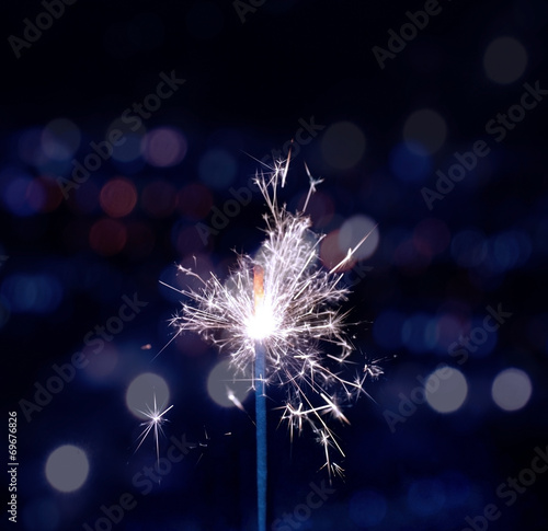 holiday background with a sparkler