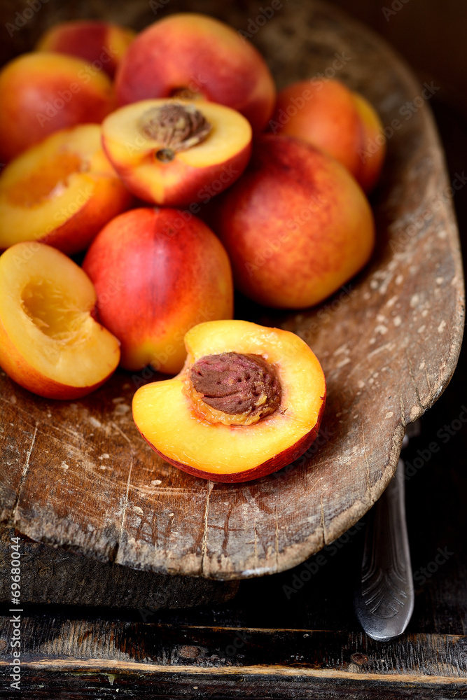 nectarines in an old wooden bucket
