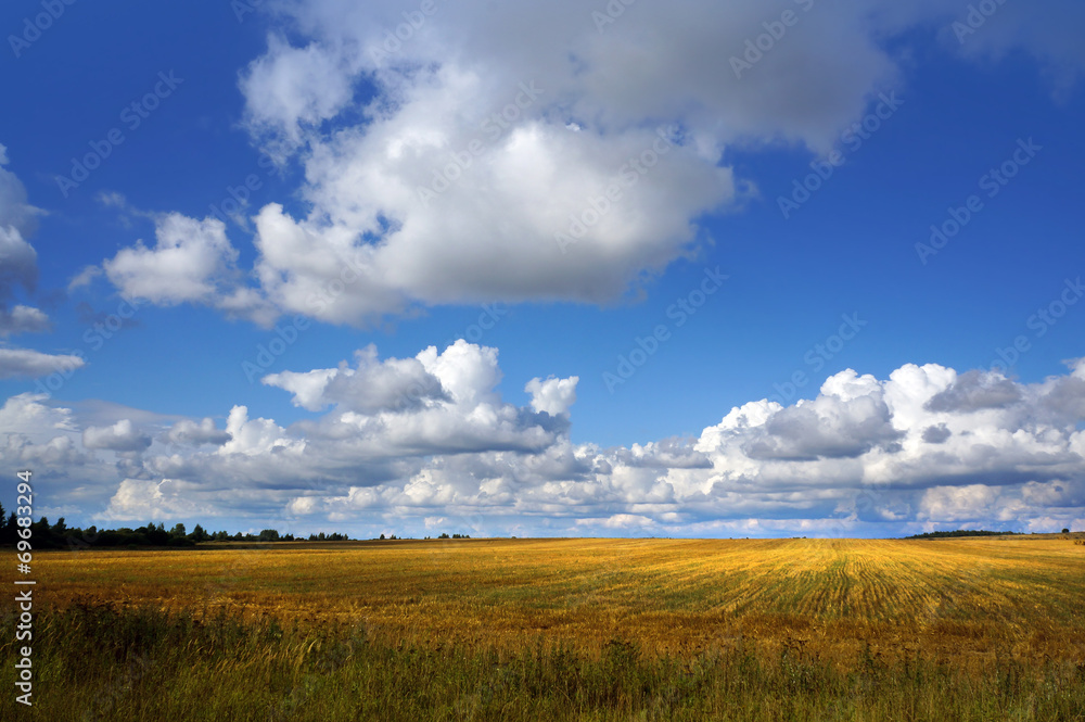 Autumnal nature,  fields  and clouds on sky