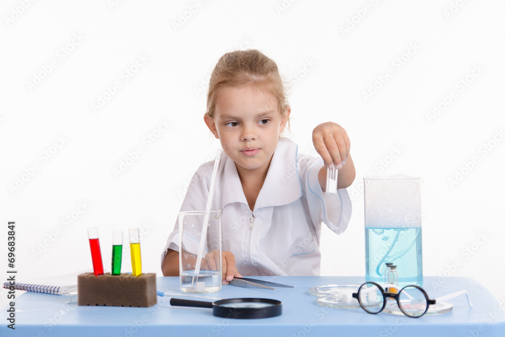 Trainee holds a vial with white powder Trainee holds a vial with white powder