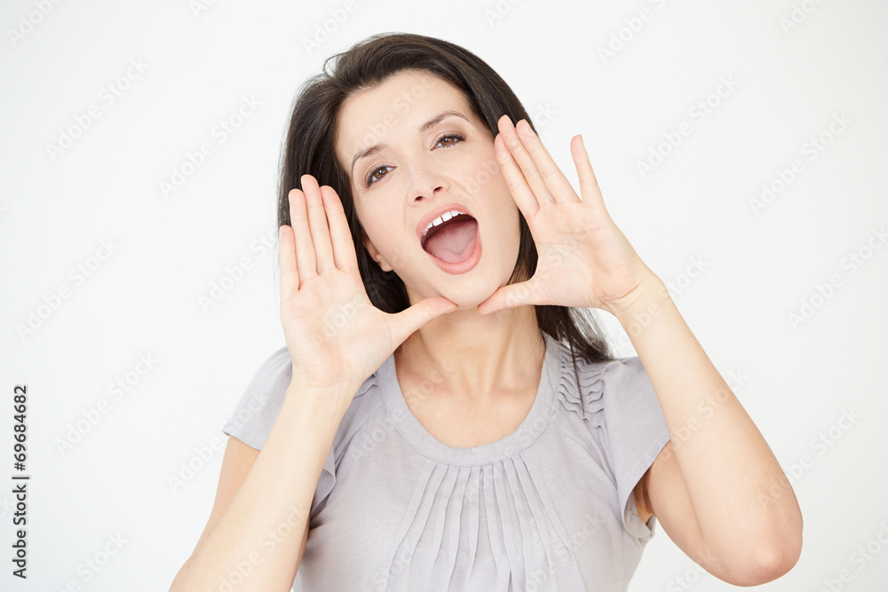 Studio Portrait Of Woman Shouting Towards Camera Studio Portrait Of Woman Shouting Towards Camera