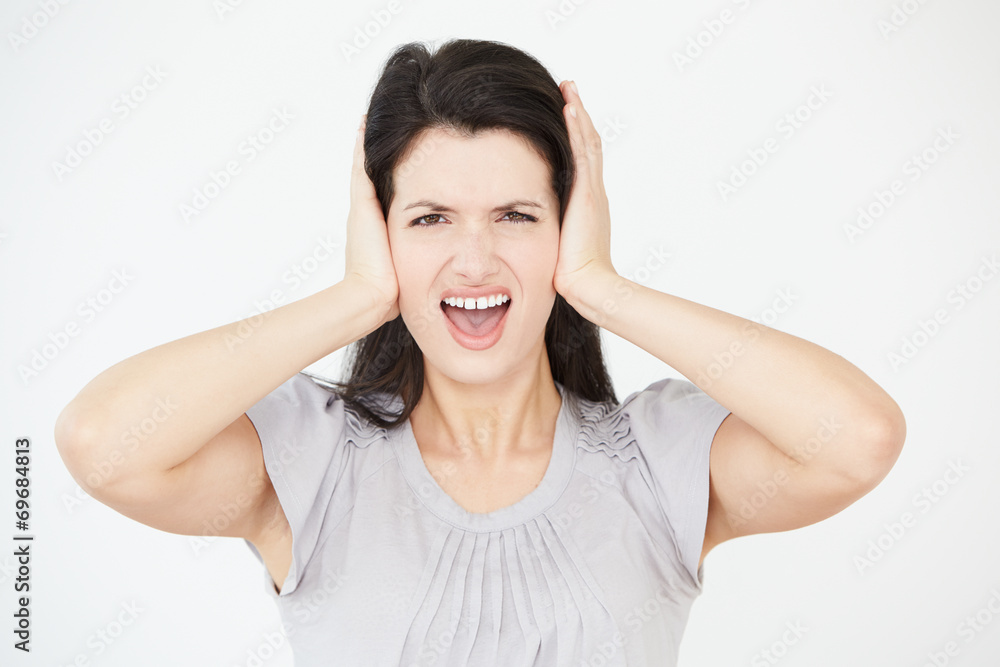 Studio Portrait Of Woman Covering Ears With Hands Studio Portrait Of Woman Covering Ears With Hands