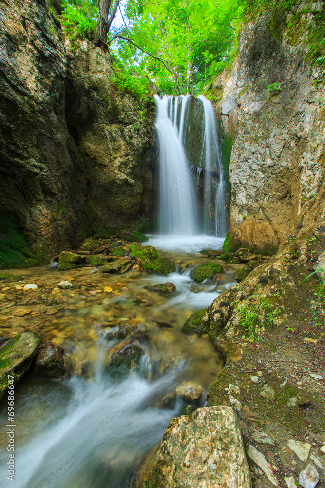 Obraz premium Deep forest waterfalls in the Transylvanian Alps