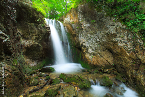 Fototapeta Naklejka Na Ścianę i Meble -  Deep forest waterfalls in the Transylvanian Alps