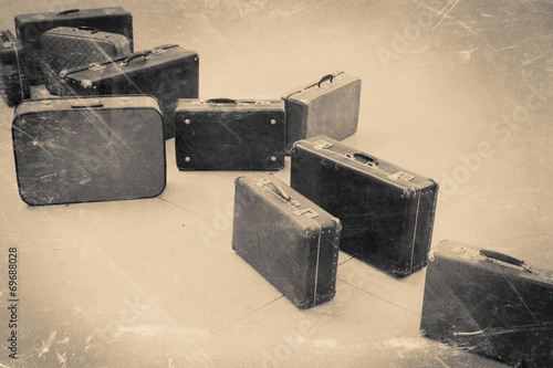 Canvas Print group of vintage suitcase on tiled floor, retro stylized