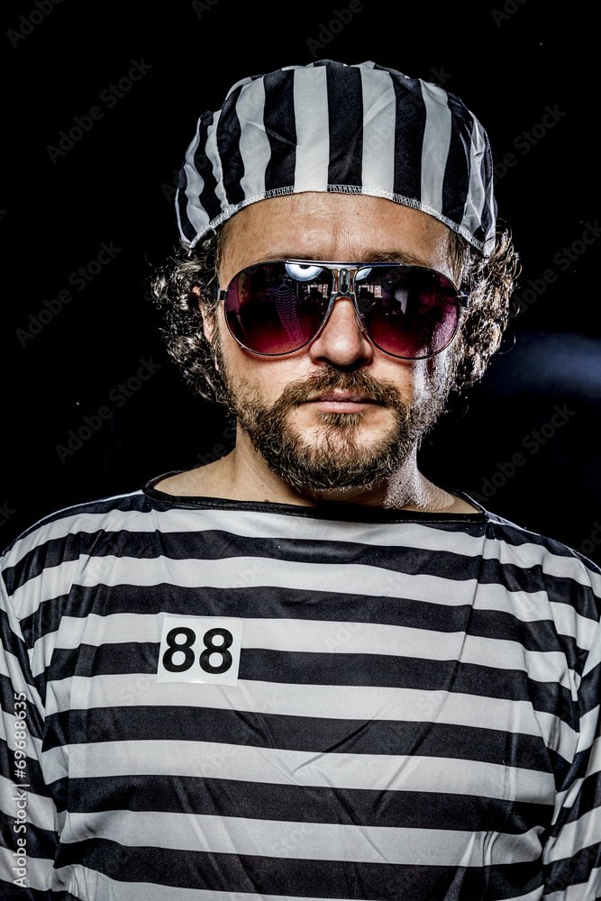 Security.Prison riot concept. Man holding a machine gun, prisone Security.Prison riot concept. Man holding a machine gun, prisone
