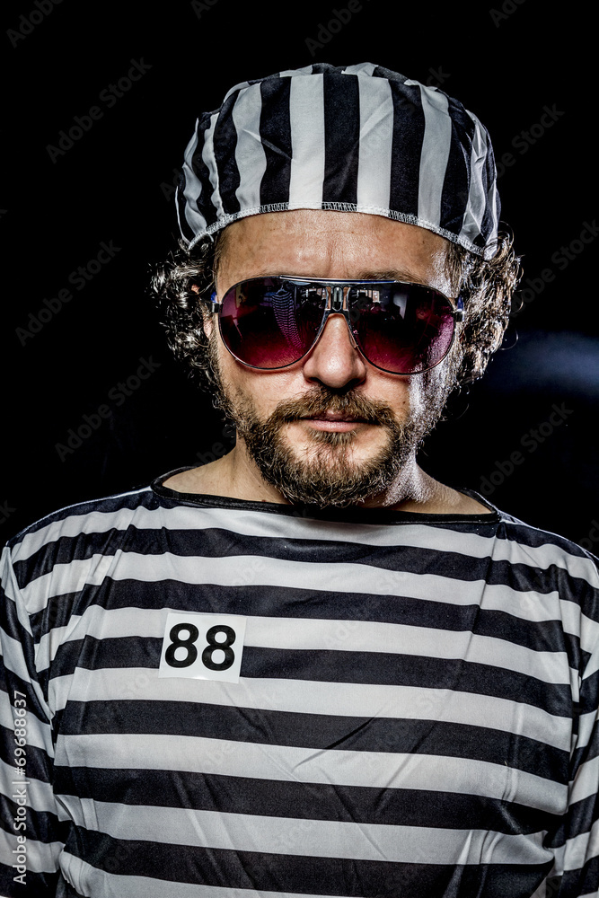 Thief. Prison riot concept. Man holding a machine gun, prisoner Thief. Prison riot concept. Man holding a machine gun, prisoner