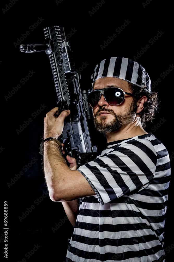 supression .Prison riot concept. Man holding a machine gun, pris supression .Prison riot concept. Man holding a machine gun, pris