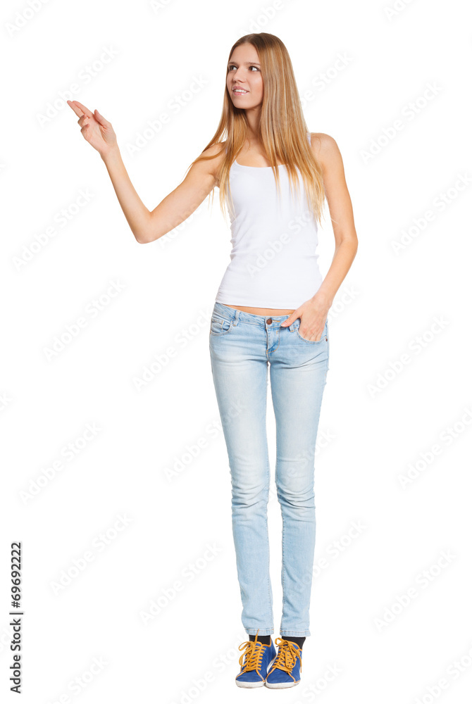 Full length of beautiful blond woman pointing at copy space Full length of beautiful blond woman pointing at copy space