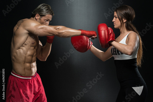 Couple Exercising Punching © Jale Ibrak