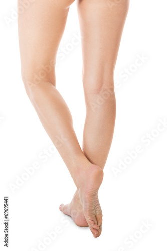 Elegant long bare female legs © juniart