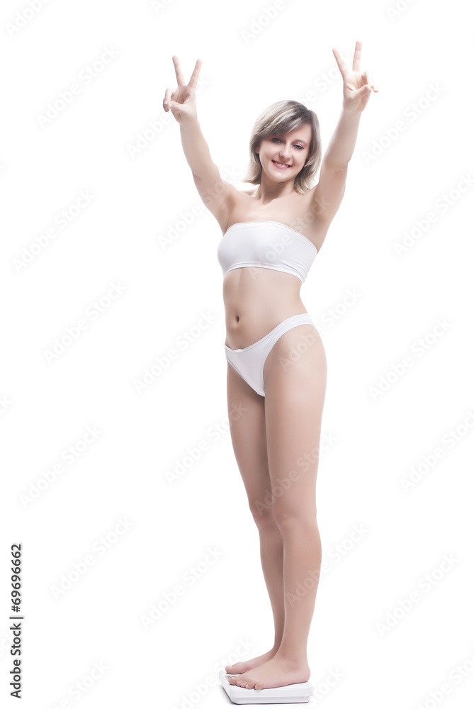 Woman With Weighing Scale Showing Peace Sign Woman With Weighing Scale Showing Peace Sign