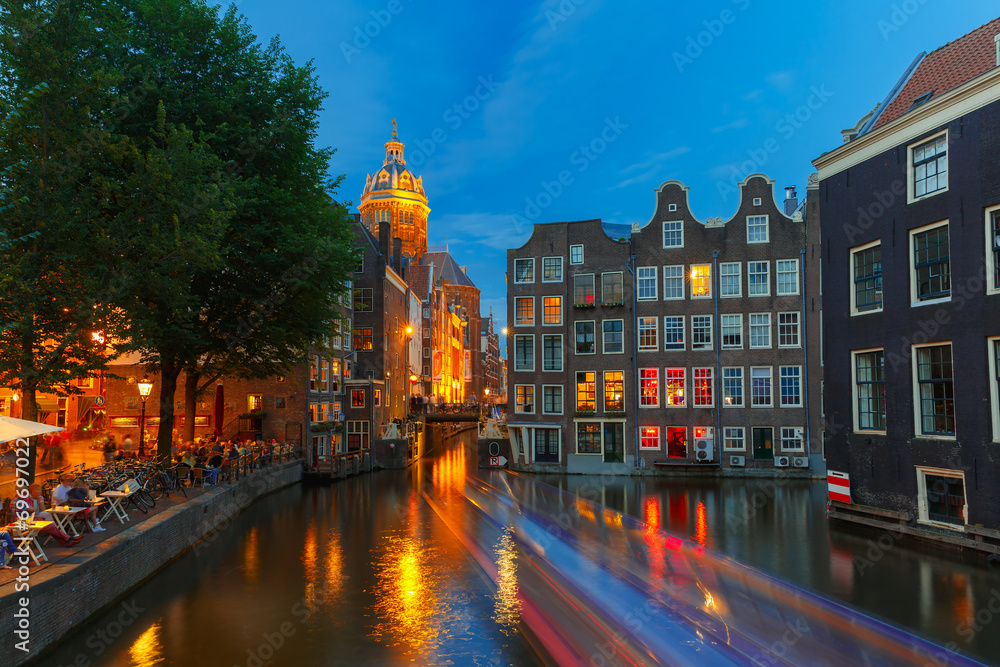 Fototapeta premium Night city view of Amsterdam canal, church and bridge