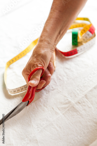 Hand Cutting Cloth with Scissors