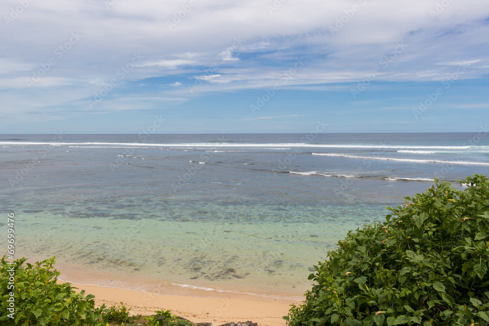 Beautiful tropical beach with lush vegetation