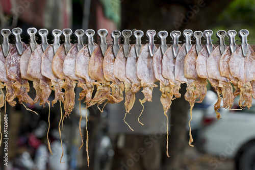 roasted squid selling in the street of bangkok photo