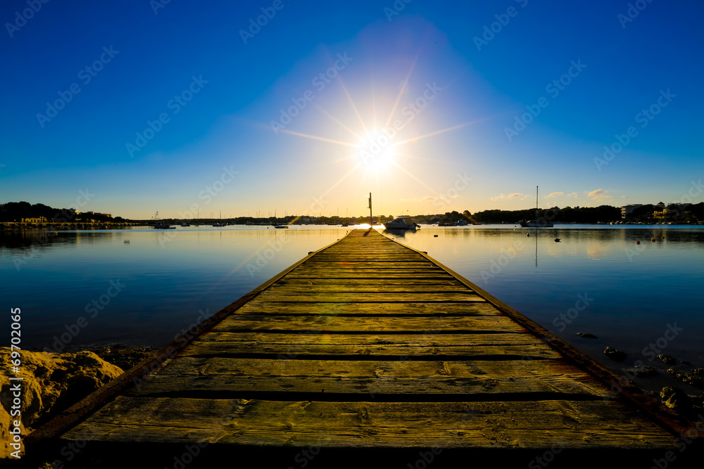 wooden jetty and sunset